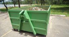Green Skip Bin With Rubbish