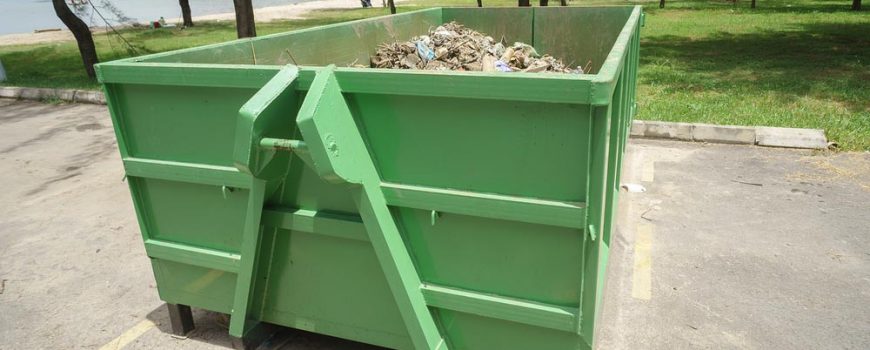 Green Skip Bin With Rubbish