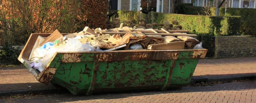 loaded dumpster in home renovations site