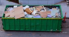 A pile of scraps and trash in a garbage bin